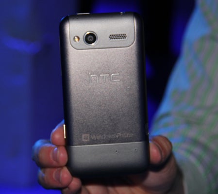 HTC Radar smartphone held in hand displaying back view.